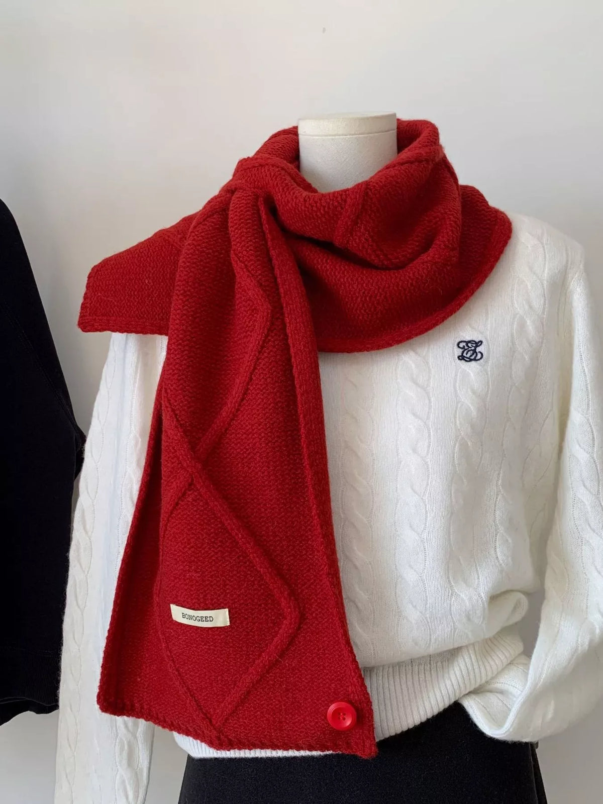 Unisex Solid Color Knitted Winter Scarf — red solid scarf draped long over a cream sweater