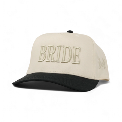The Mad Hatter Company Bride Snapback Hat, natural crown with a black bill and tonal Bride lettering