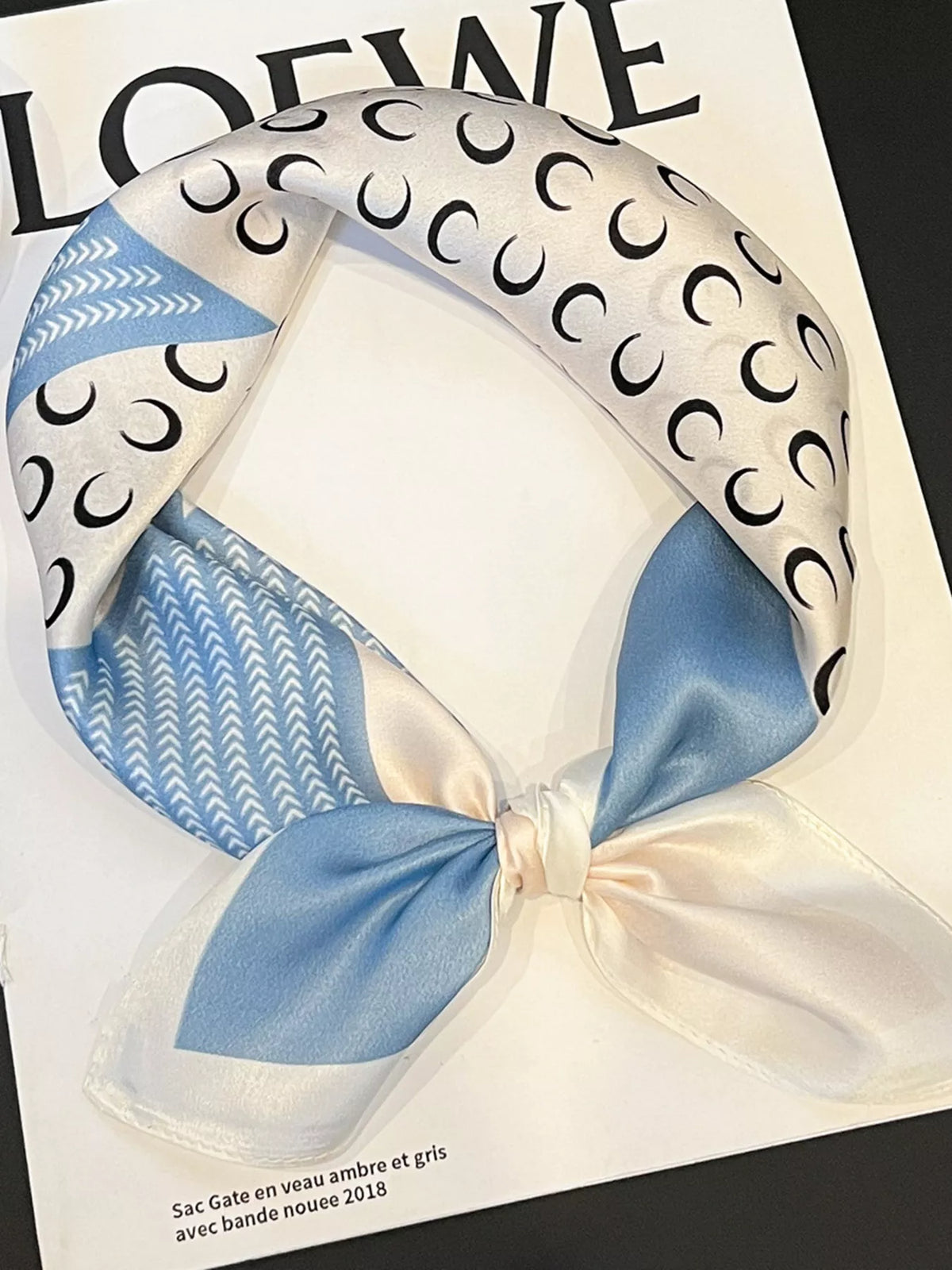 Unisex Printed Silk Square Scarf — knotted scarf showing blue and cream print panels