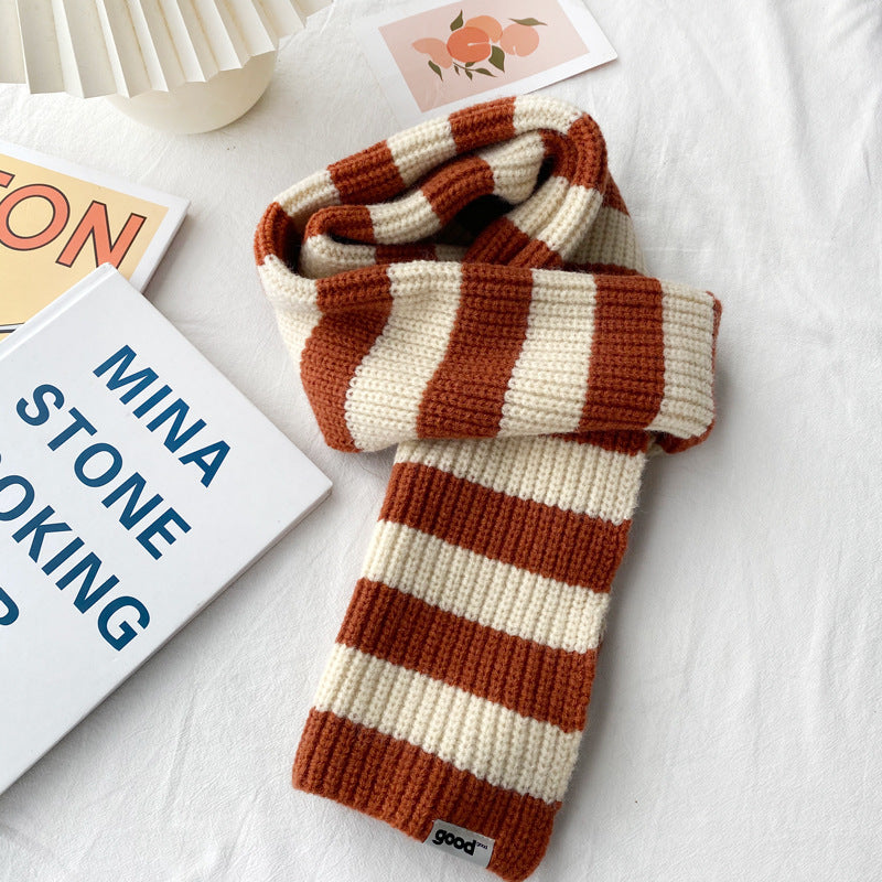 Rust and cream striped scarf with a folded knit end
