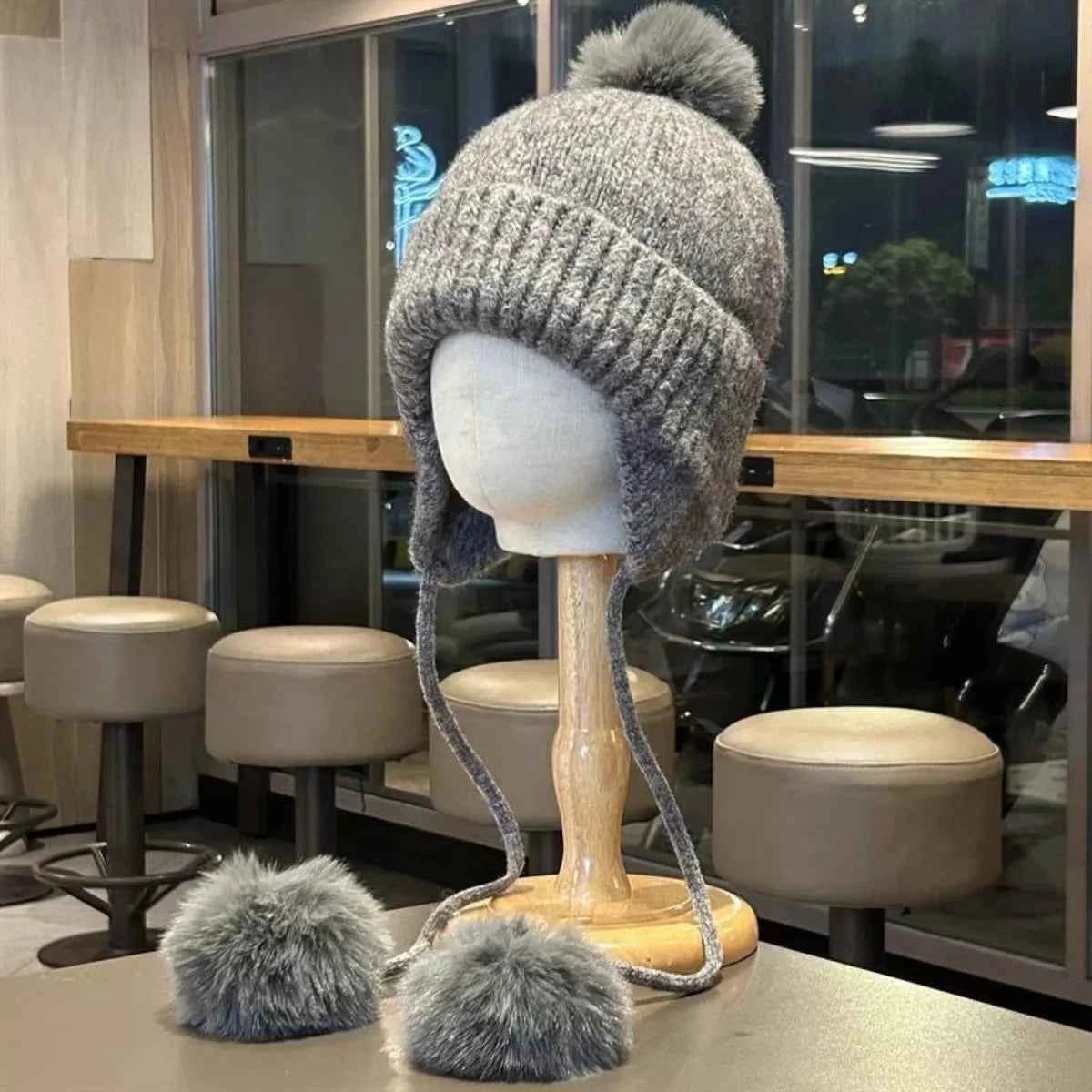 Brown knitted pom pom beanie cozy front