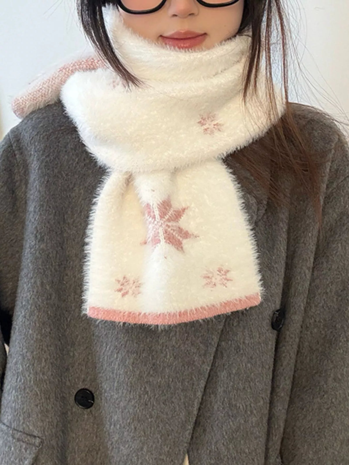 Unisex Snowflake Plush Knit Scarf — closer outfit view showing pink winter motifs