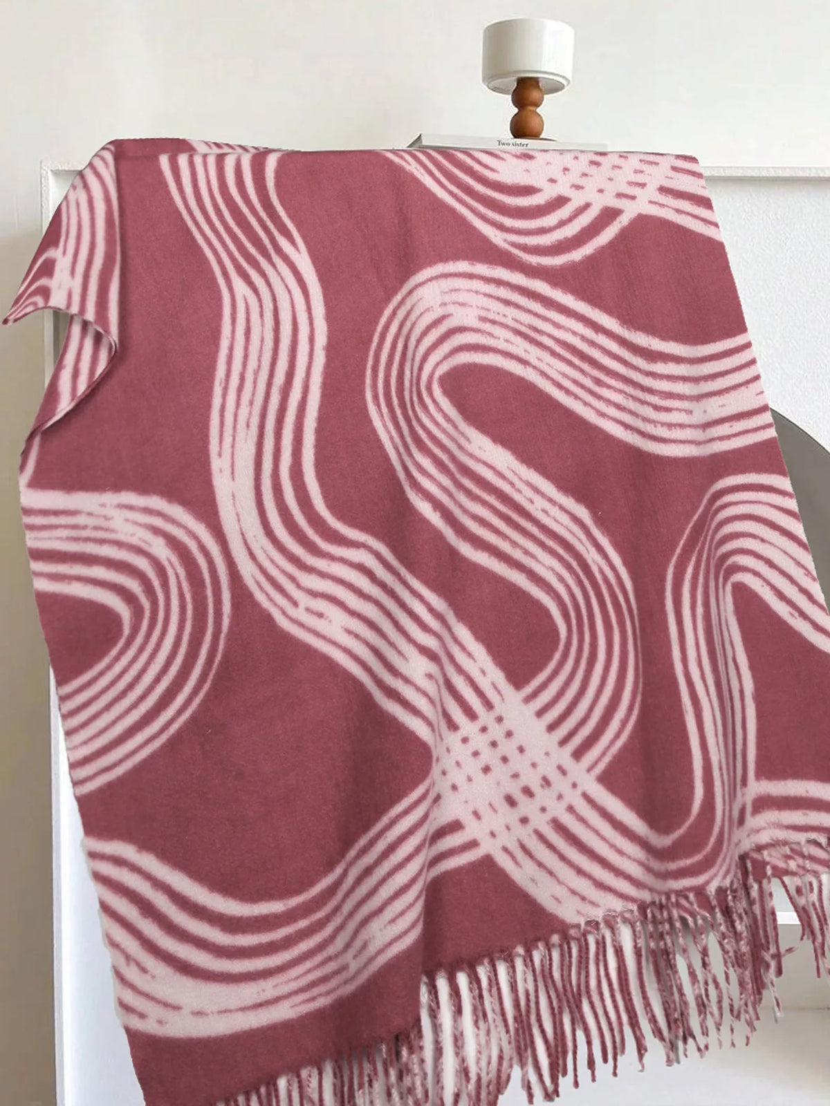 Unisex Geometric Patterned Fringe Scarf — pink scarf displayed flat with pale curved motifs