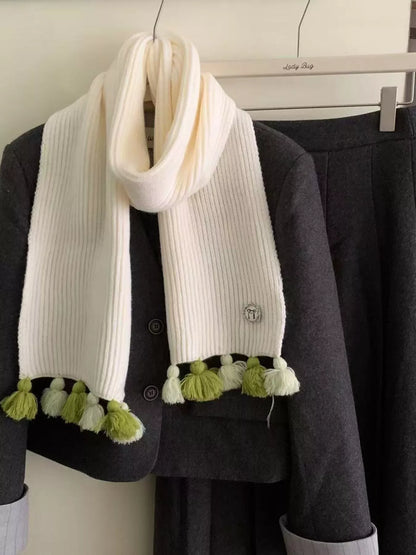 Unisex Ribbed Knit Tassel Scarf — long drape of cream scarf over a dark jacket
