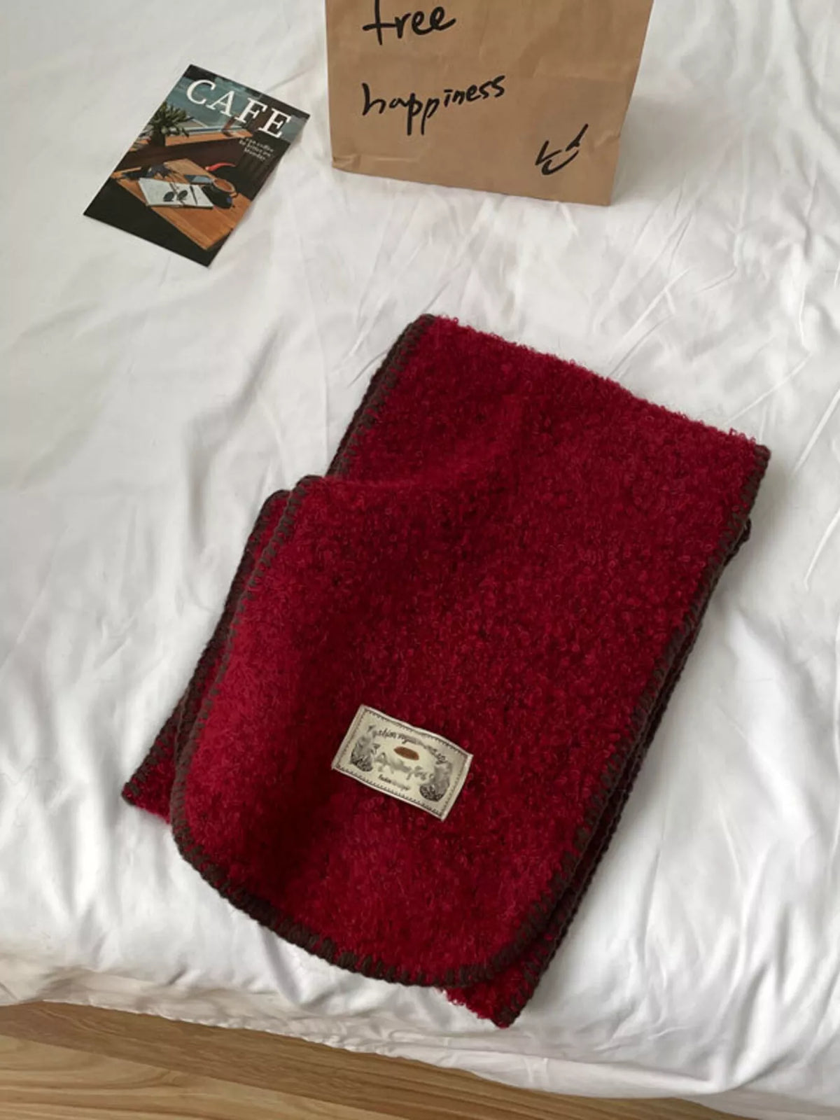 Unisex Contrast Edge Plush Scarf — folded red scarf showing rounded contrast edge