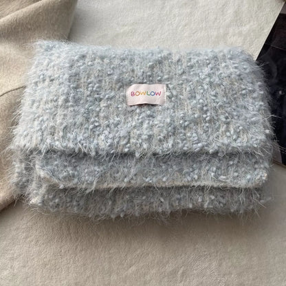 Unisex Soft Plush Winter Warm Scarf — folded pale blue scarf with small label