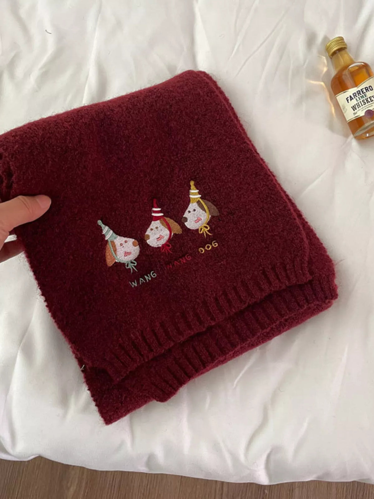 Unisex Embroidered Dog Knit Scarf — dark red scarf folded to show its animal details