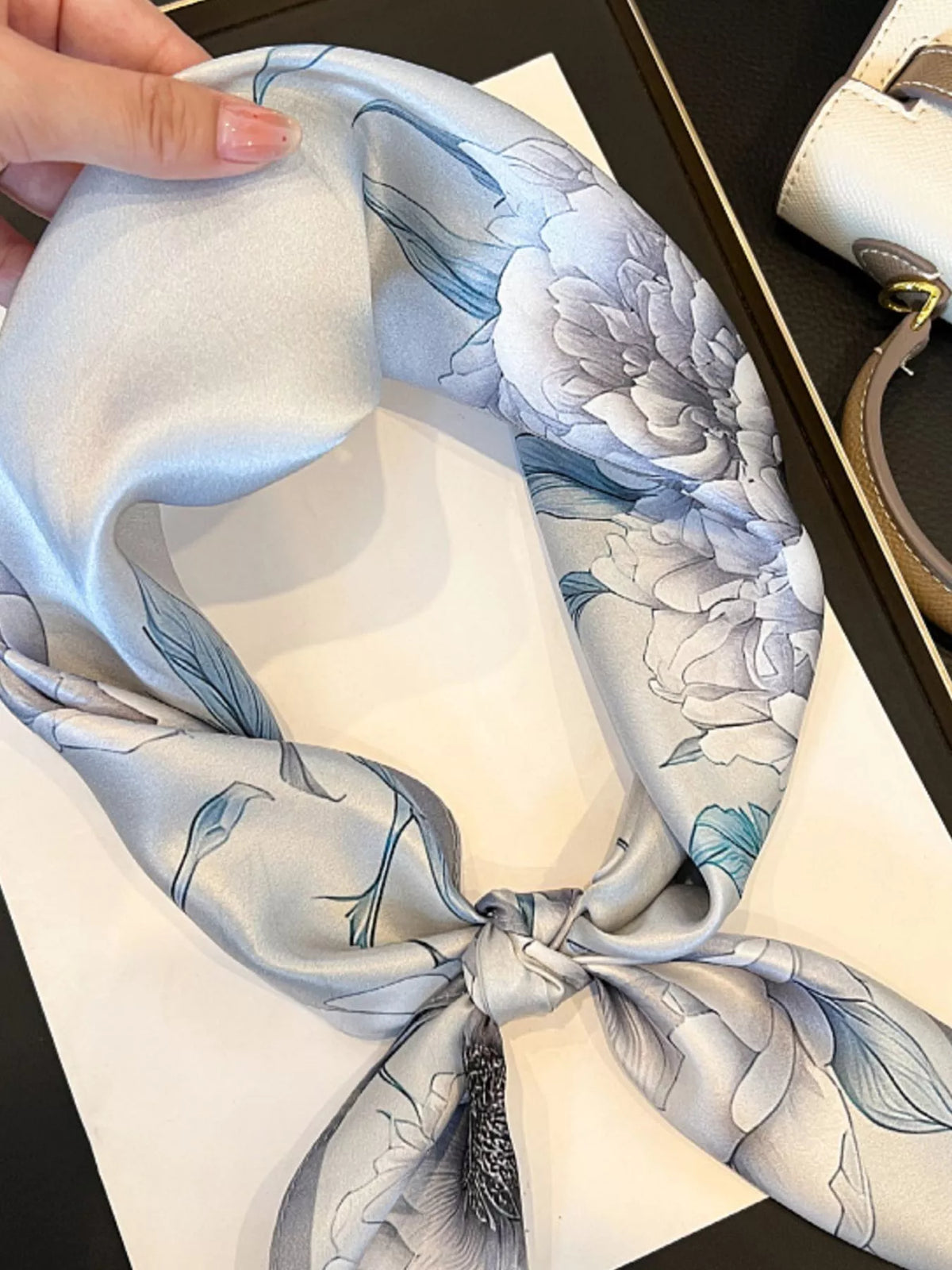Unisex Floral Print Silk Square Scarf — knotted floral scarf with a large flower near the tie