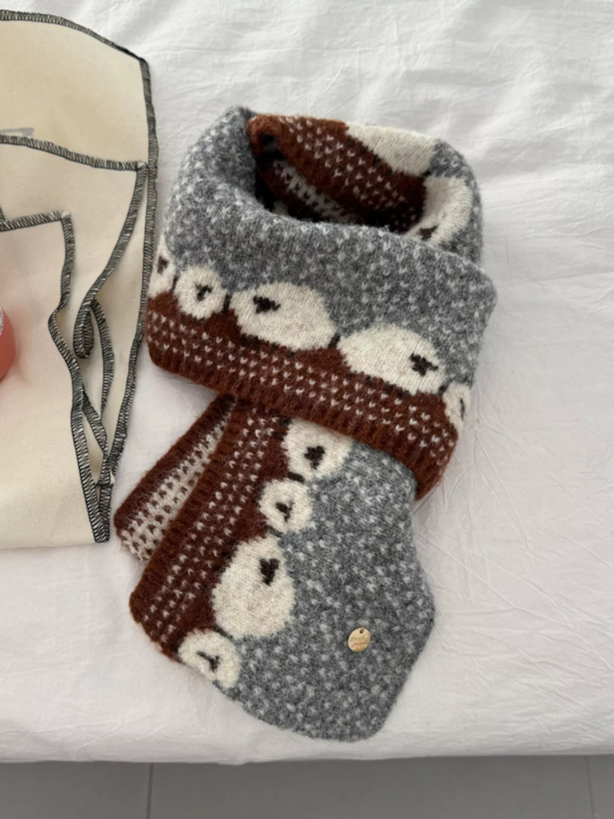 Unisex Sheep Motif Knit Scarf — gray scarf showing repeated sheep along the end