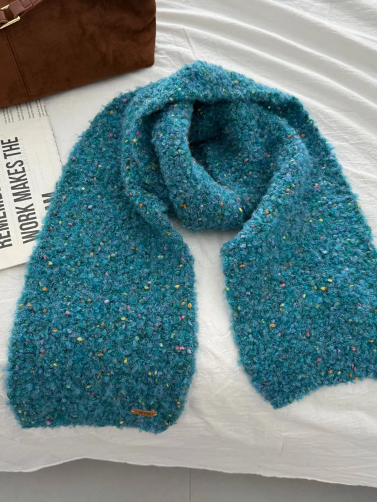 Unisex Multicolor Speckled Knit Scarf — blue scarf with scattered colored flecks shown in a loop