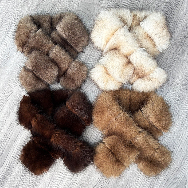 Four neutral segmented faux fur crisscross scarves arranged together
