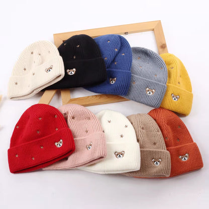 Collection of teddy bear and star embroidered cuffed beanies