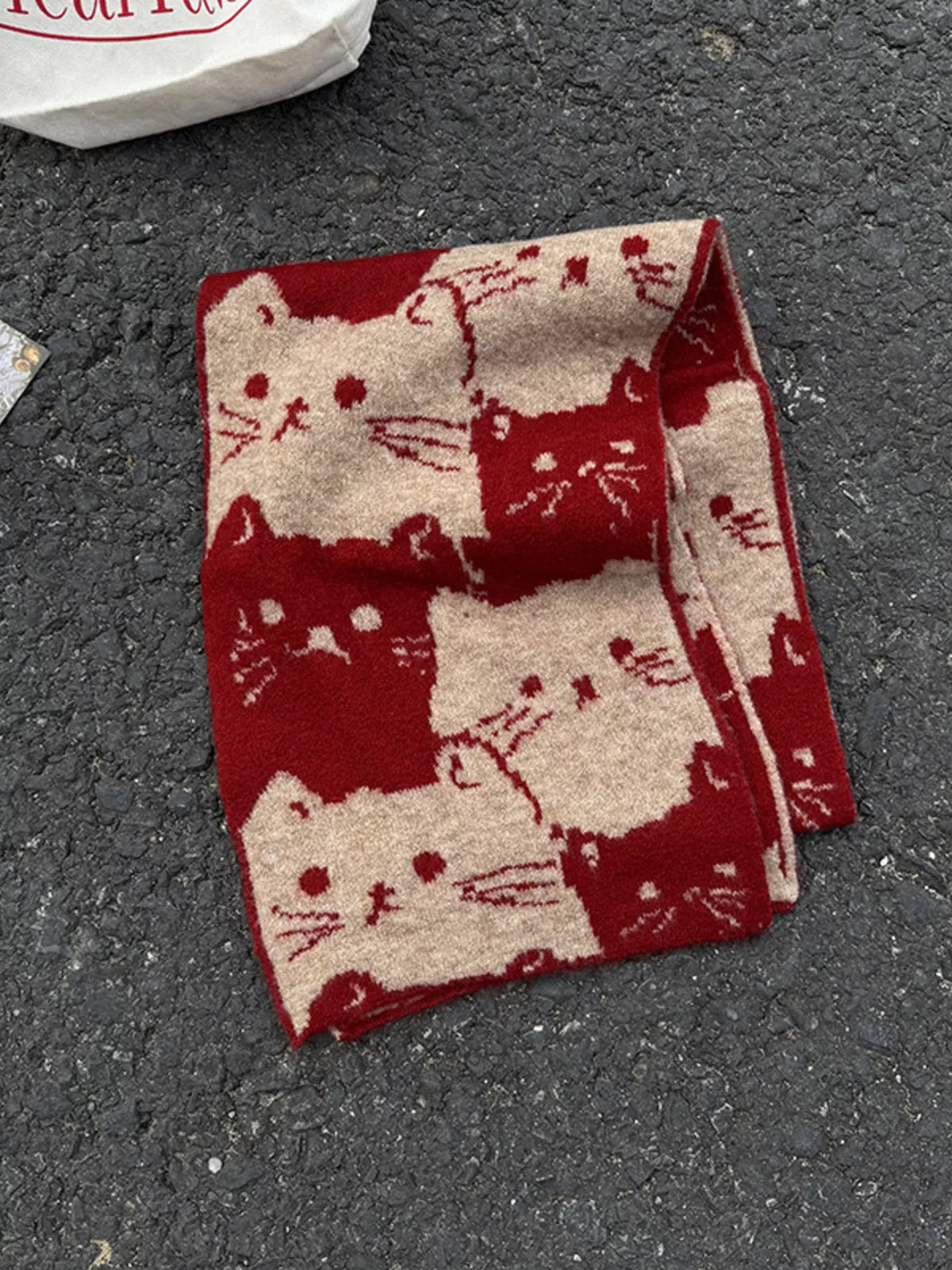 Unisex Allover Cat Knit Scarf — folded red scarf showing its large cat motifs