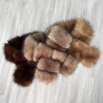 Brown and beige plush scarves showing segmented cross-front shapes