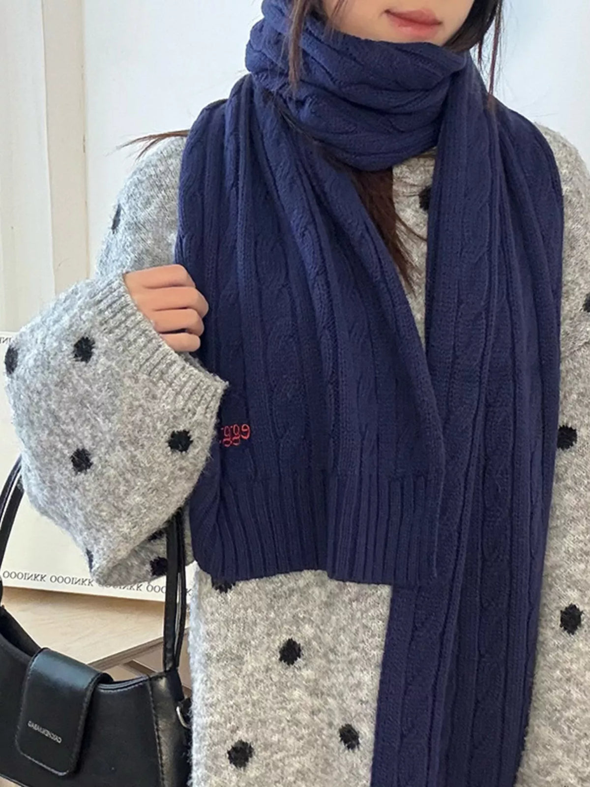 Unisex Cable Rib Winter Scarf — closer outfit view of a blue textured scarf