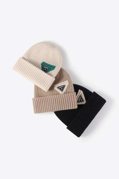 Knit winter beanie with bold HAPPY lettering