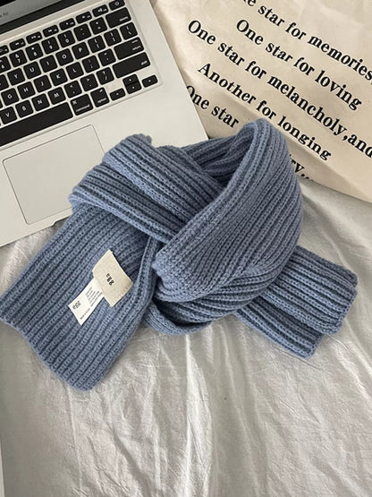 Unisex Compact Ribbed Knit Scarf — blue rib scarf tied beside a laptop
