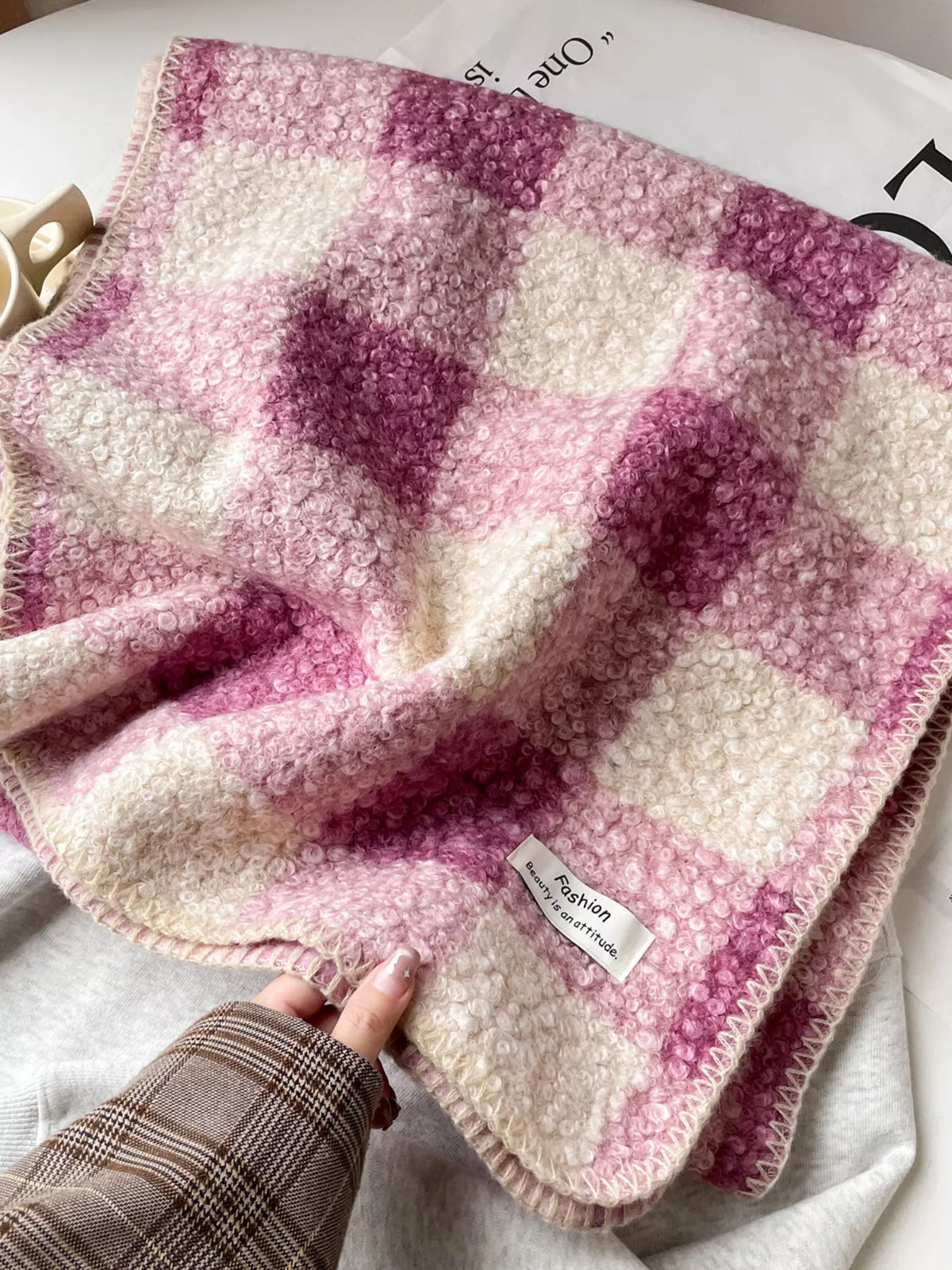 Unisex Textured Plaid Knit Scarf — close view of pink checked knit texture