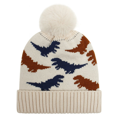 Beige kids jacquard beanie with brown and navy dinosaurs