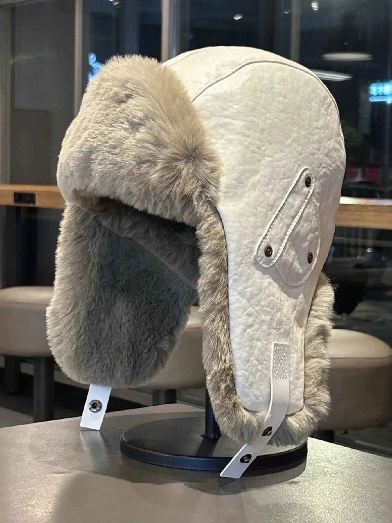 Beige warm fuzzy ear flap hat front view