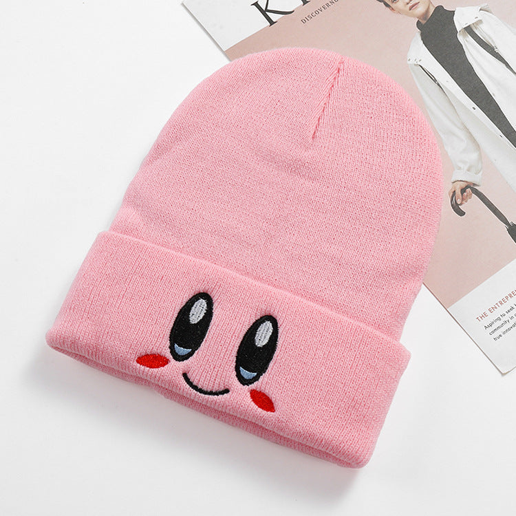 Single pink smile face beanie with a ribbed cuff