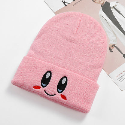 Single pink smile face beanie with a ribbed cuff