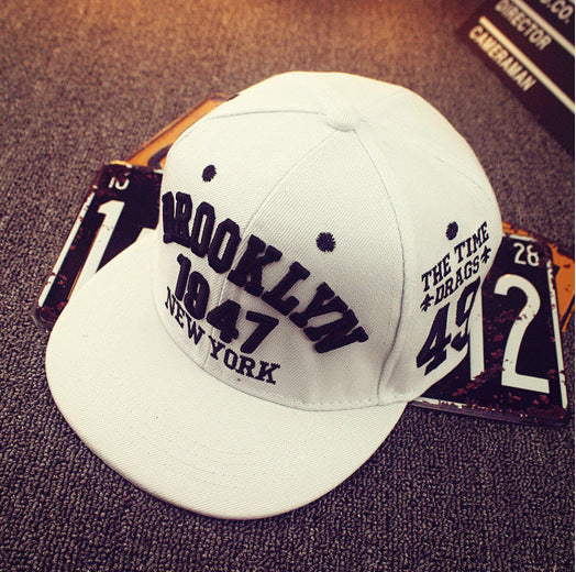 White streetwear snapback with embroidered lettering