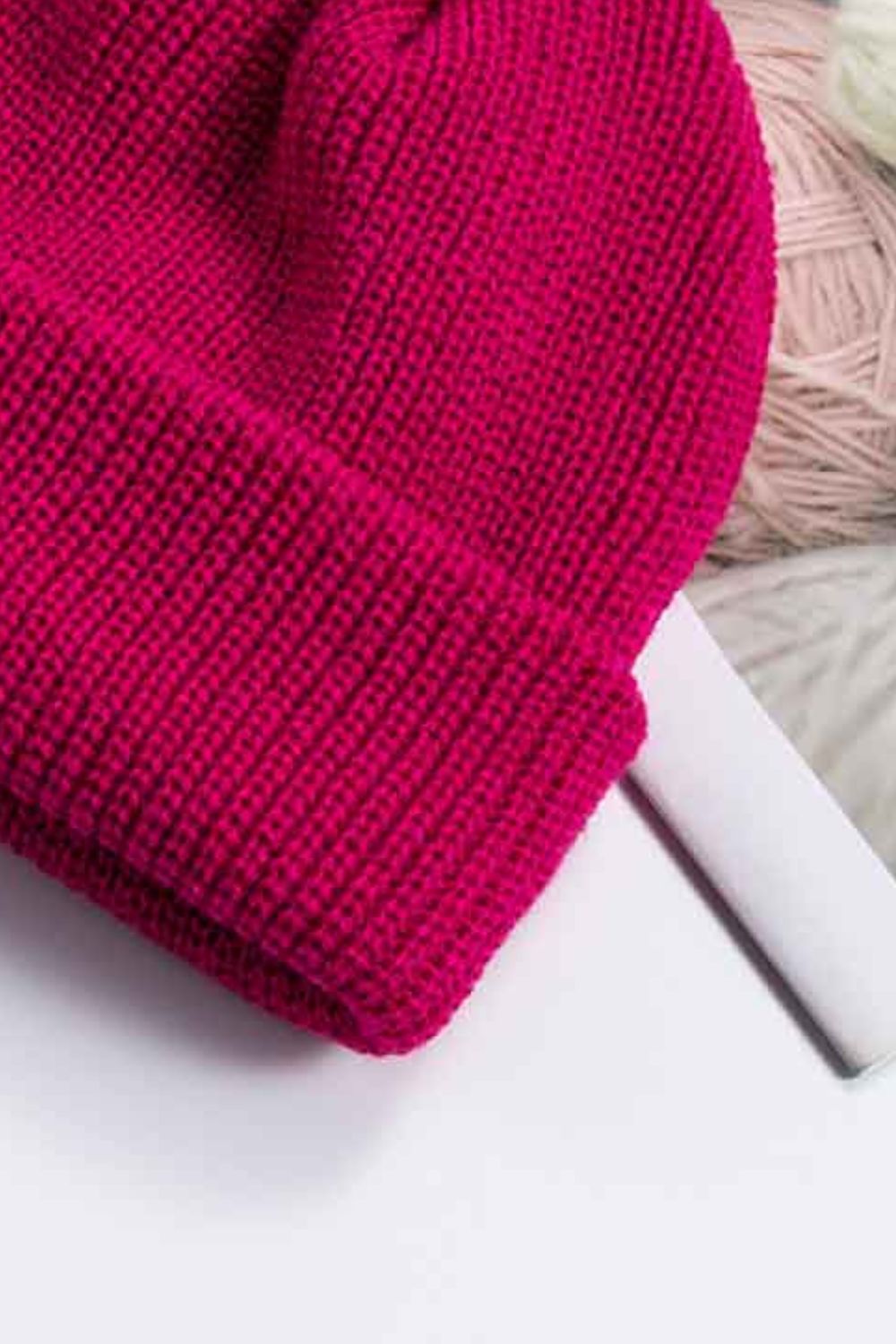 Solid color rib-knit beanie top crown detail