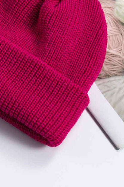 Solid color rib-knit beanie top crown detail