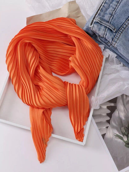 Unisex Pleated Satin Neck Scarf — orange pleated scarf tied on a pale surface