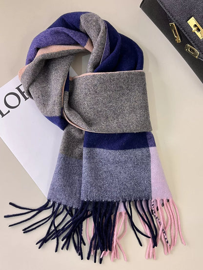 Unisex Plaid Fringe Scarf — indigo and muted plaid scarf tied on a magazine