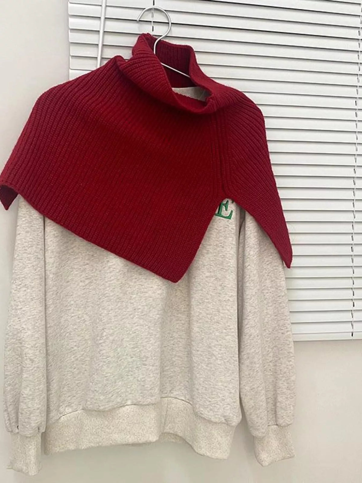 Women's Ribbed Knit Capelet — red high neck shoulder layer displayed on a hanger