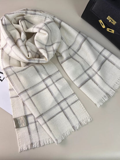 Unisex 100% Wool Raw Hem Plaid Scarf — pale grid scarf arranged loosely on printed pages
