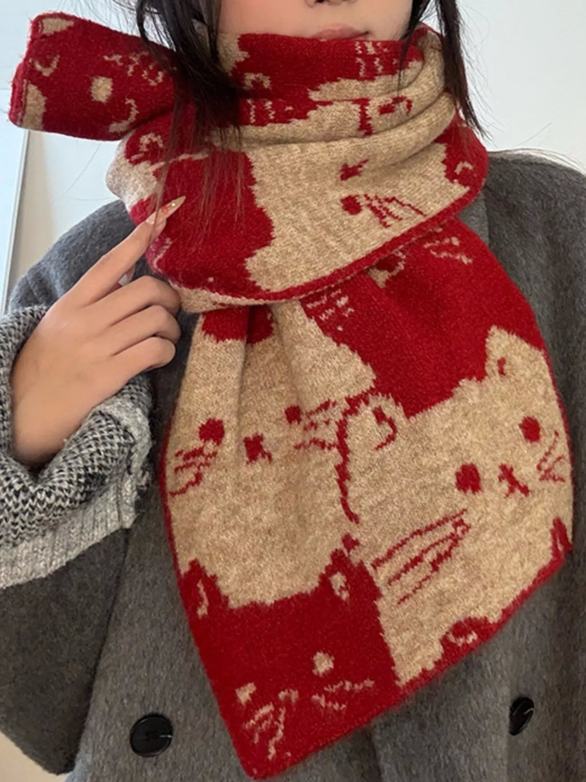 Unisex Allover Cat Knit Scarf — red cat scarf wrapped over a gray sweater