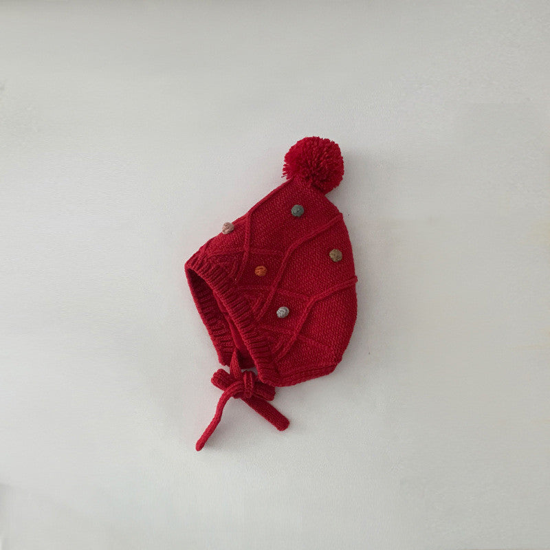 Red kids earflap beanie with pom pom and tie ends