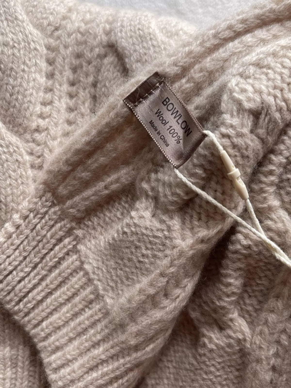 Unisex Wool Cable Knit Winter Scarf — close detail of beige wool knit and ribbed end border