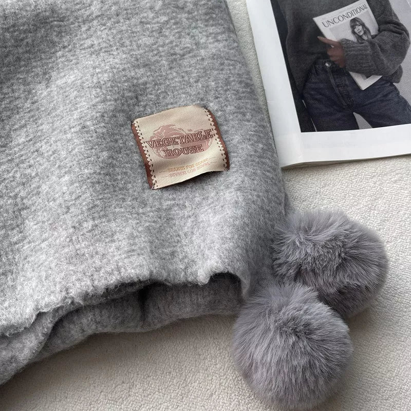 Unisex Pom-Pom Tassel Warm Scarf — close detail of gray textured scarf and pom-pom trim
