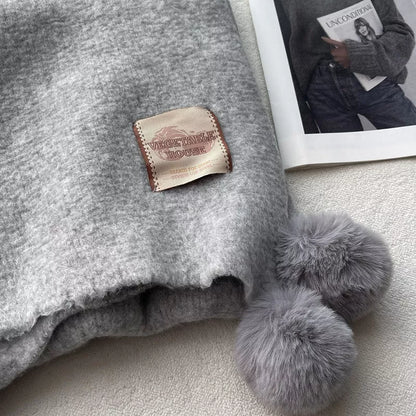 Unisex Pom-Pom Tassel Warm Scarf — close detail of gray textured scarf and pom-pom trim