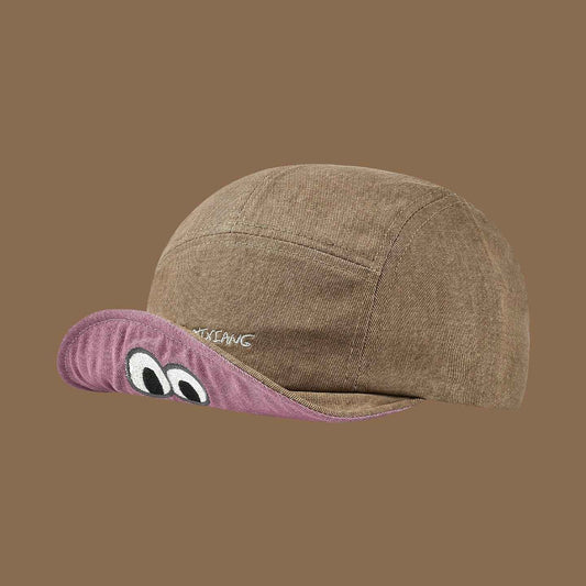 Black woven duckbill cap cartoon eye detail