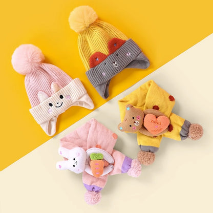 Three colorful animal beanie and scarf sets shown in a flat lay