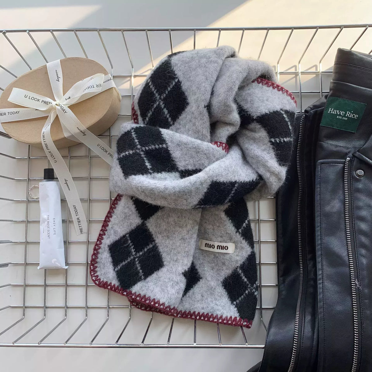 Unisex Argyle Pattern Warm Scarf — gray scarf with black argyle diamonds loosely tied