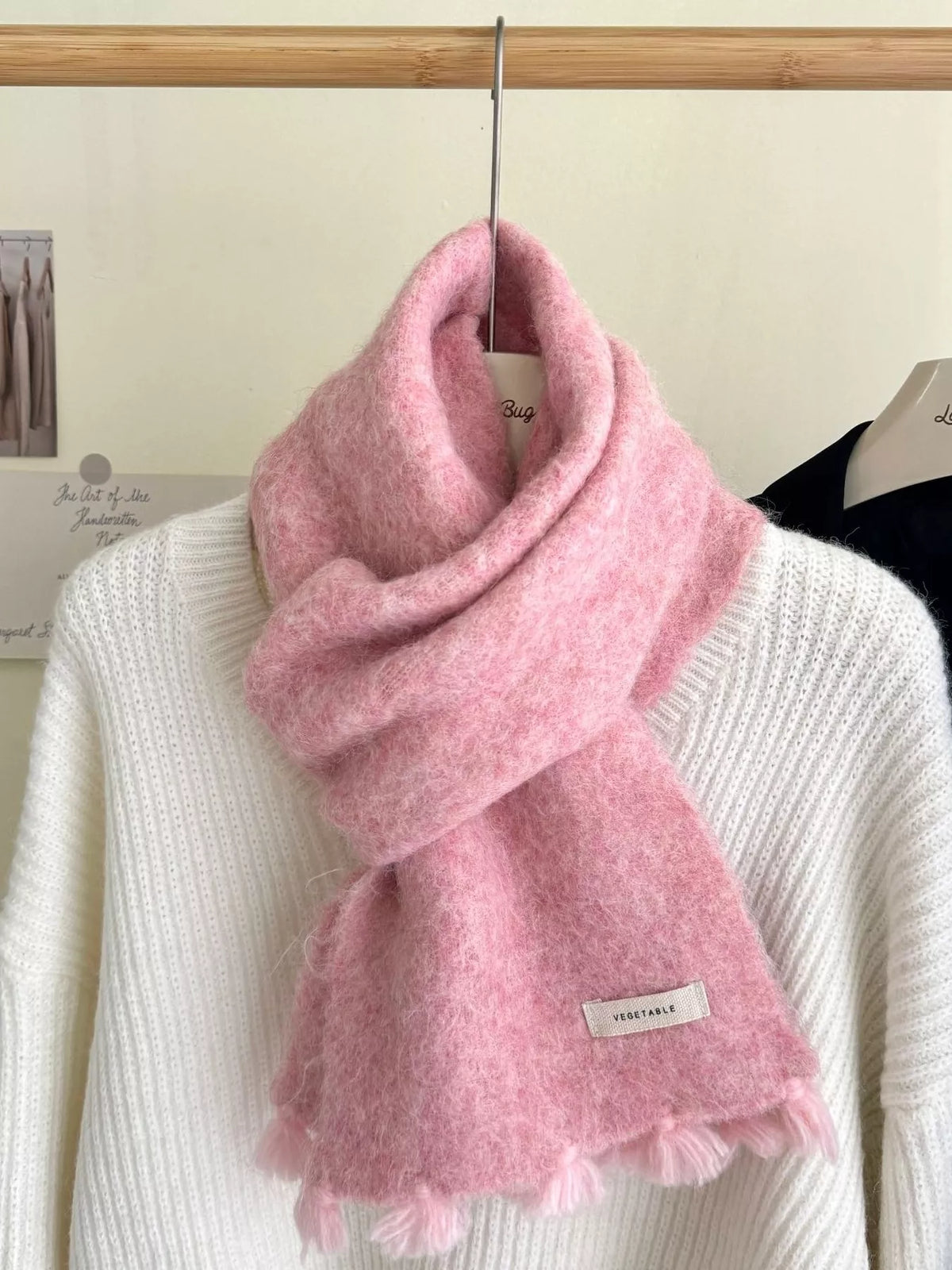 Unisex Tassel Knitted Scarf — pink wool scarf crossed over a pale sweater