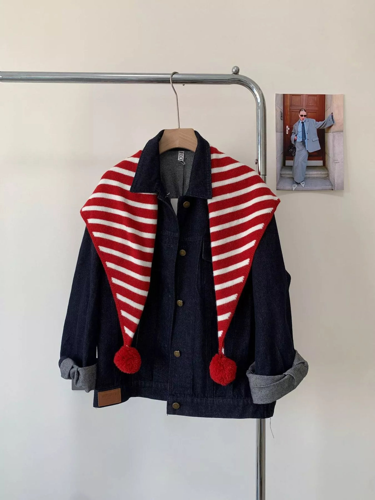 Unisex Striped Knitted Scarf with Pom-Poms — red stripe scarf draped long over a jacket
