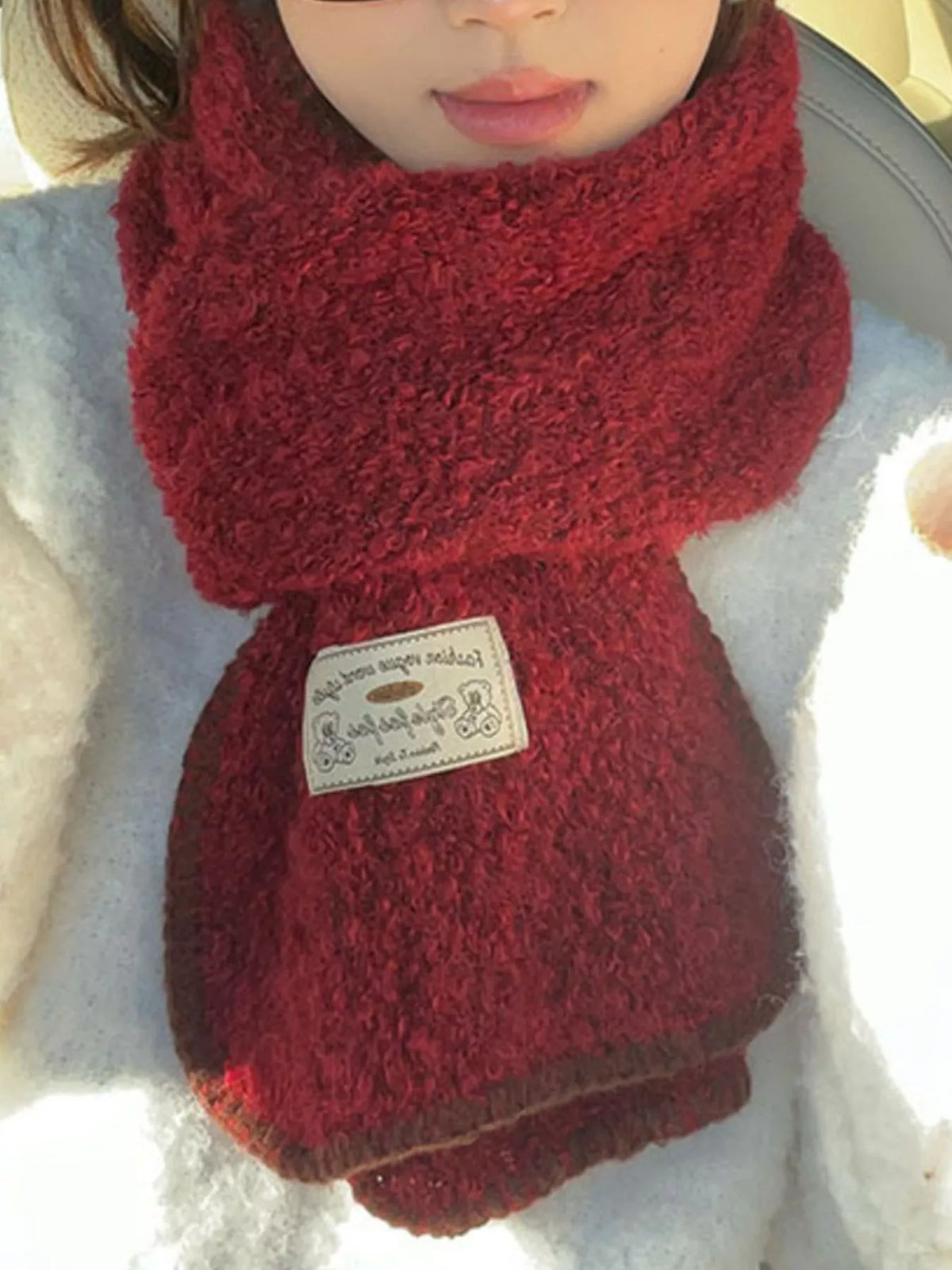 Unisex Contrast Edge Plush Scarf — red plush-looking scarf worn with outlined ends visible