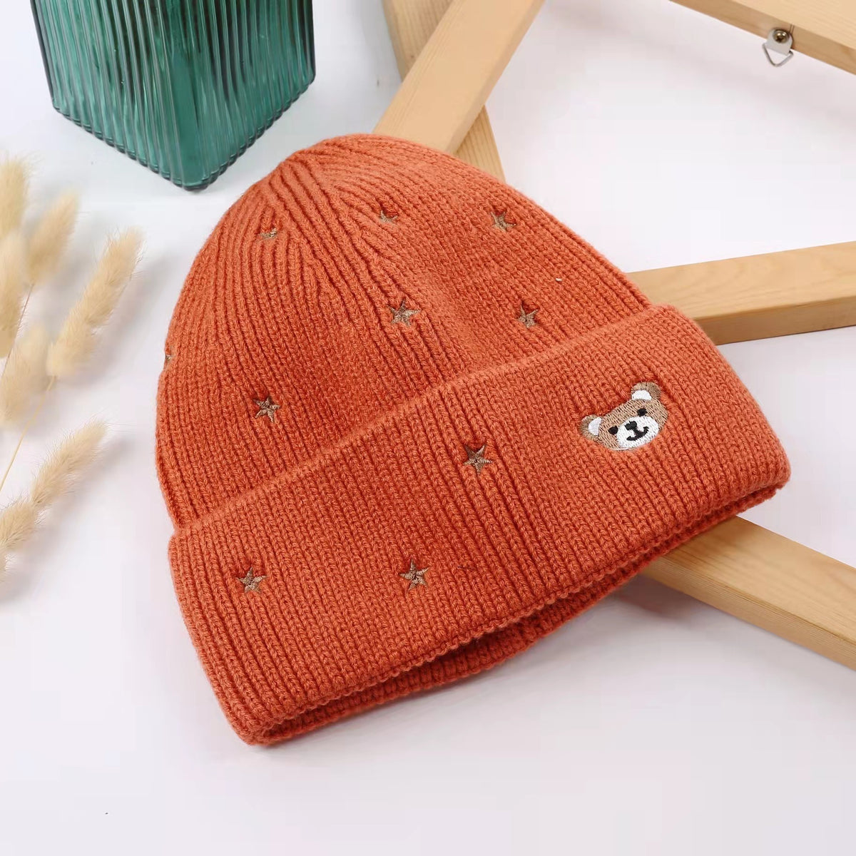 Orange wool-listed knit beanie with bear and star embroidery