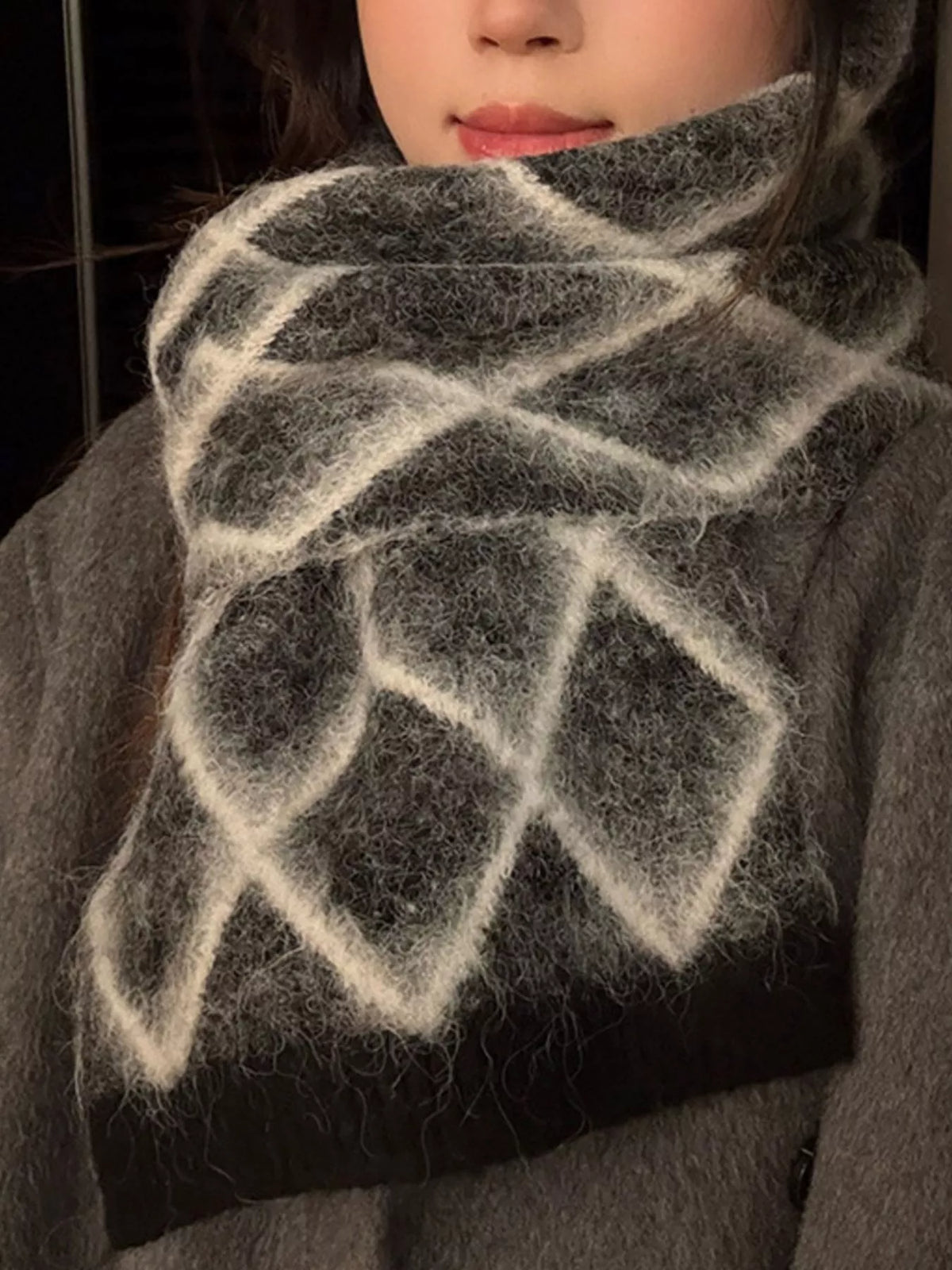 Unisex Diamond Grid Fuzzy Scarf — dark grid scarf worn with a pale winter coat