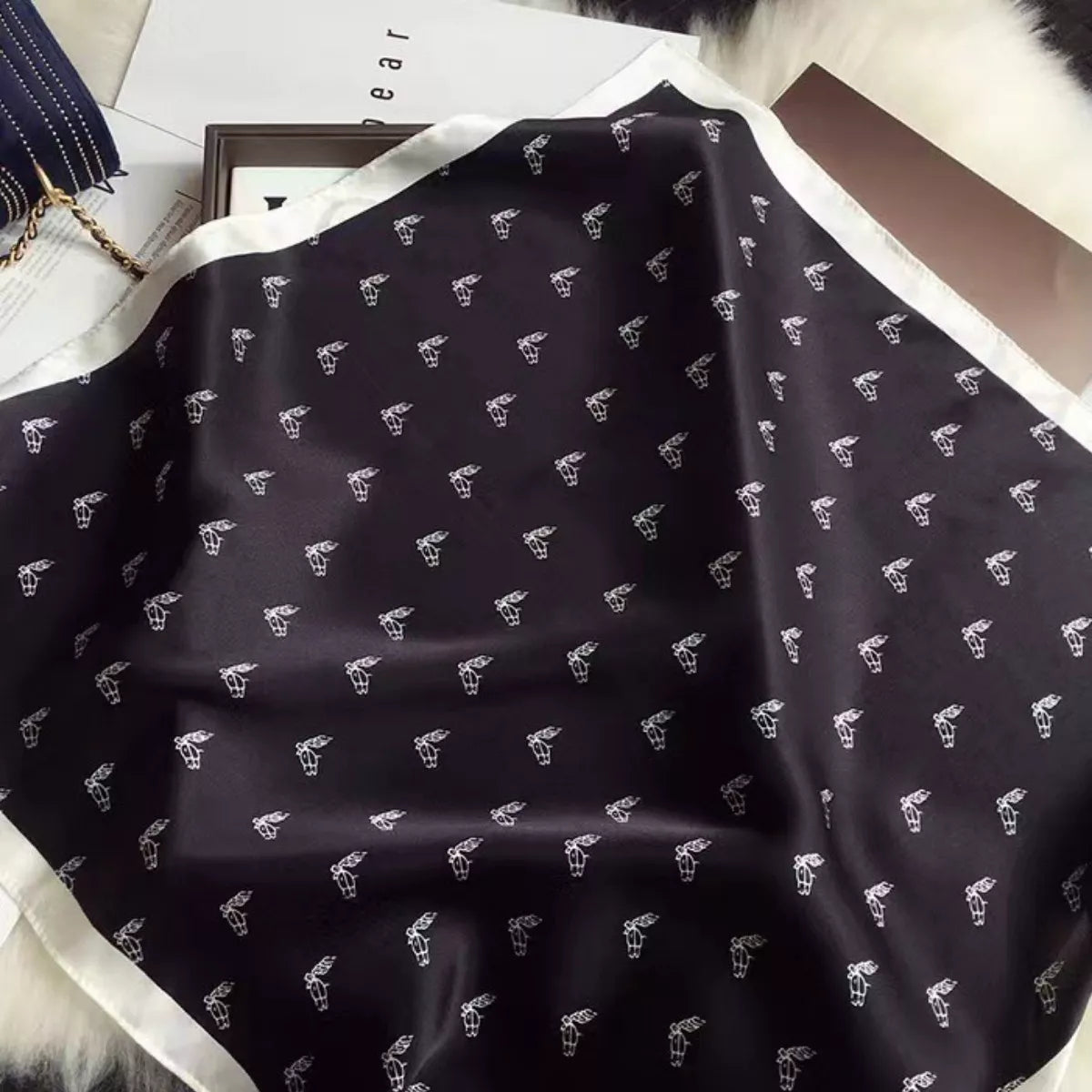 Unisex Printed Lightweight Silk Scarf — close view of small motifs on dark silk fabric
