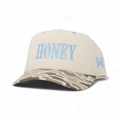 The Mad Hatter Company Honey Snapback, natural crown with a camouflage bill and blue Honey lettering