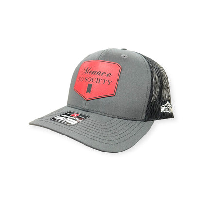 Angled view of Menace to Society patch hat by Horizon Hat Co. in charcoal/black showing the curved bill and side panels