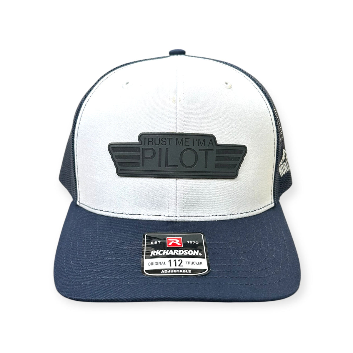 Front view of Trust Me, I'm a Pilot patch hat by Horizon Hat Co. in white/navy showing aviation-humor pilot patch